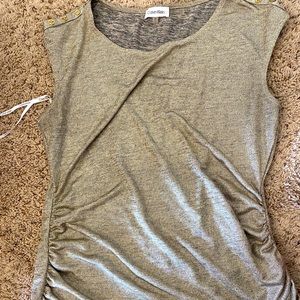 Shimmery sleeveless shirt.